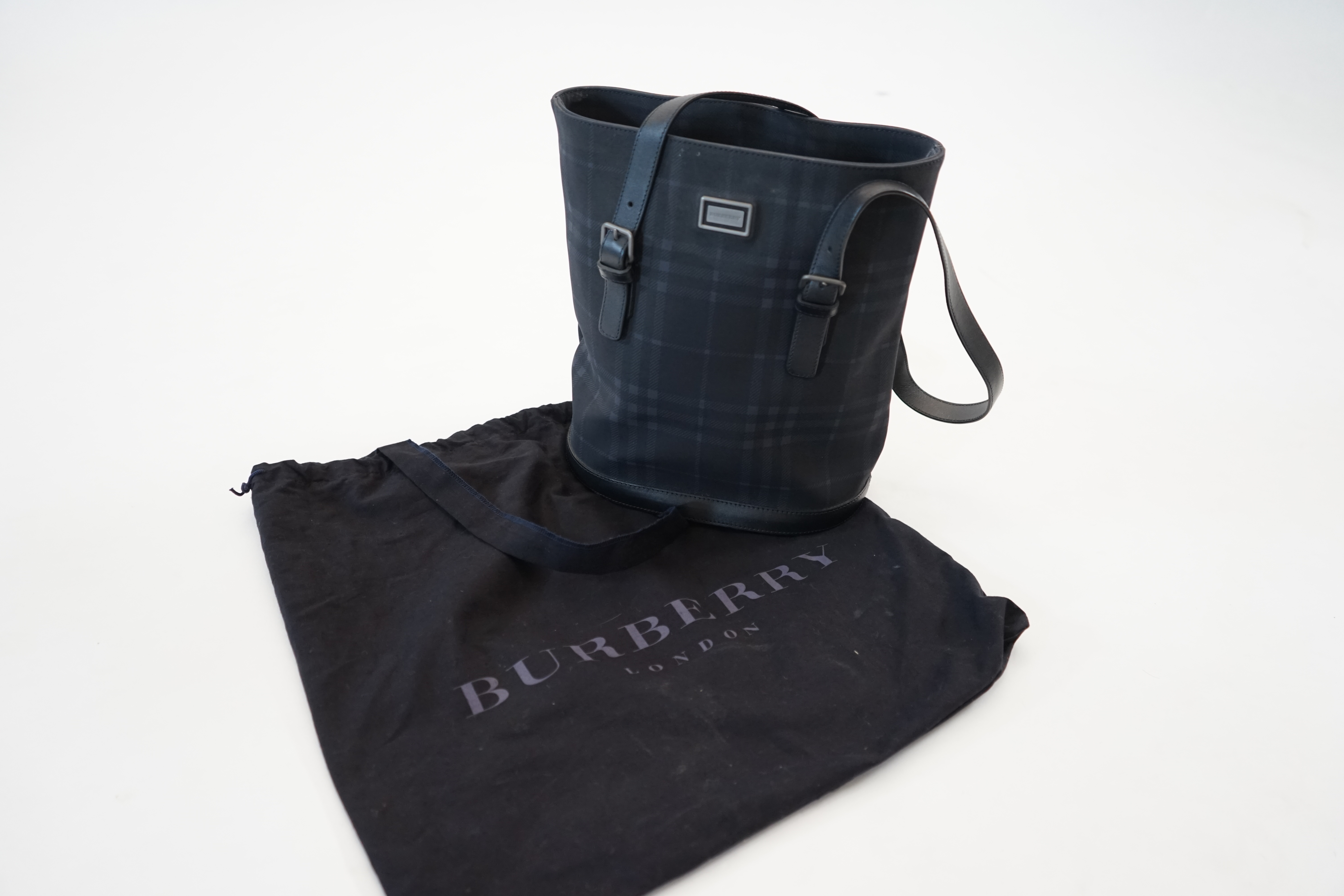 A Burberry bucket bag in blue black tartan canvas and leather, width 26cm, depth 16cm, height 27cm